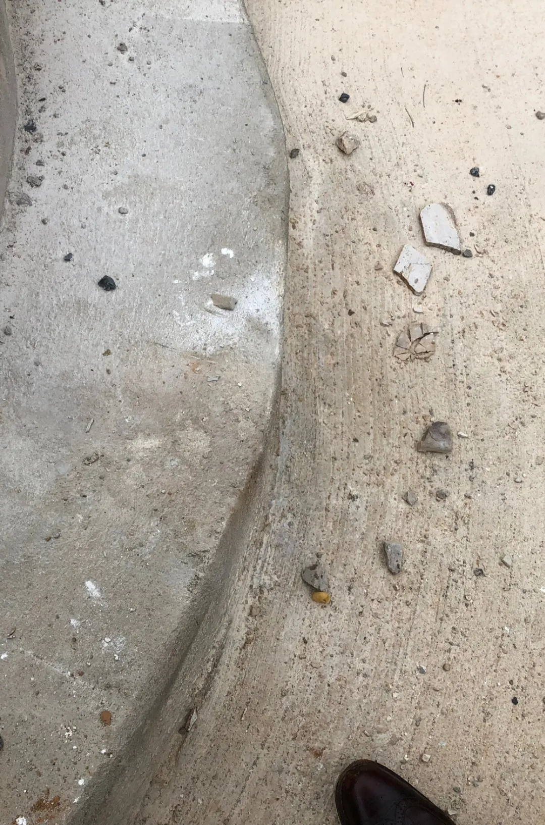 Pool renovation in progress by Alpha Pool Renovations in Northern Virginia, showing workers and resurfacing equipment.