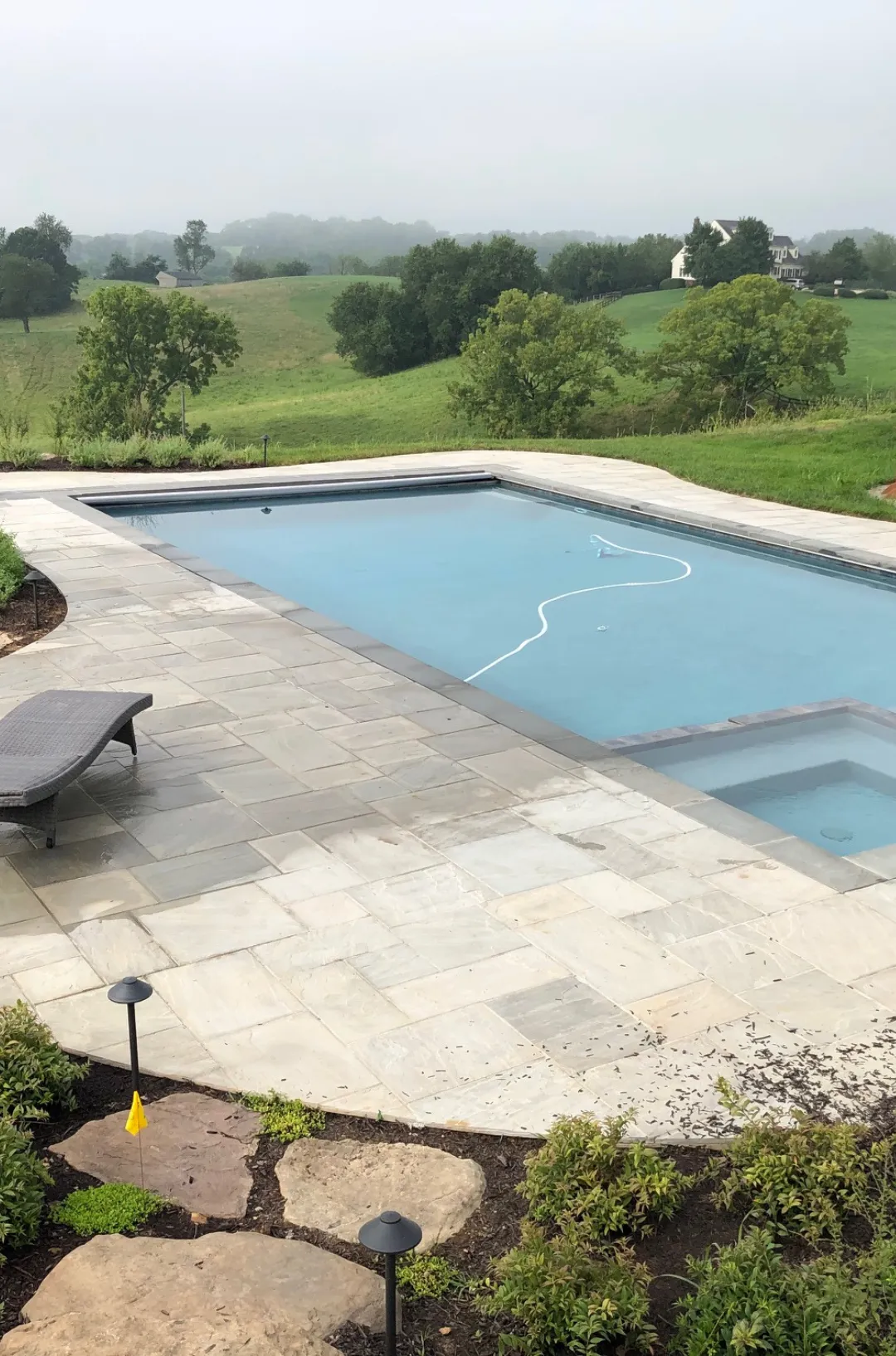 Large fully renovated residential swimming pool with new plaster finish, tile, coping, and upgraded equipment in Northern Virginia